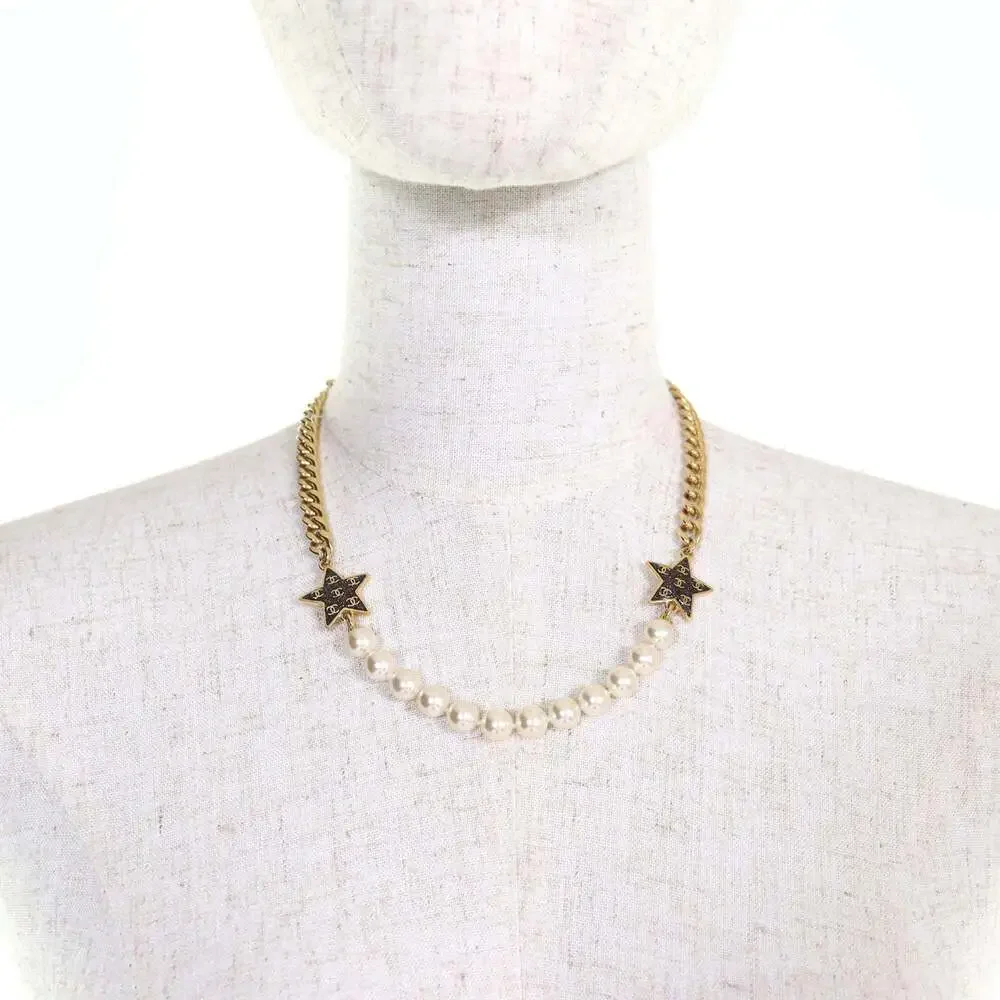 CHANEL White Pearl Logo Necklace